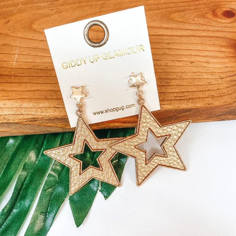 Women’s gold earrings-She's a Star Gold Post Dangle Earrings with Leather Star in Gold