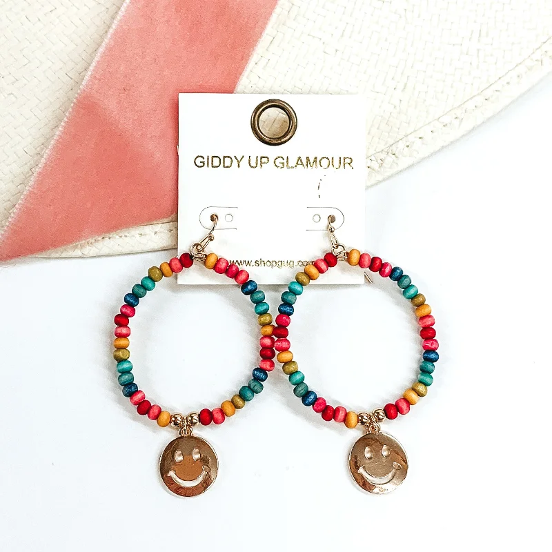 Women’s pearl hoop earrings-Wood Beaded Circle Drop Earrings with Gold Happy Face Charm in Multicolored